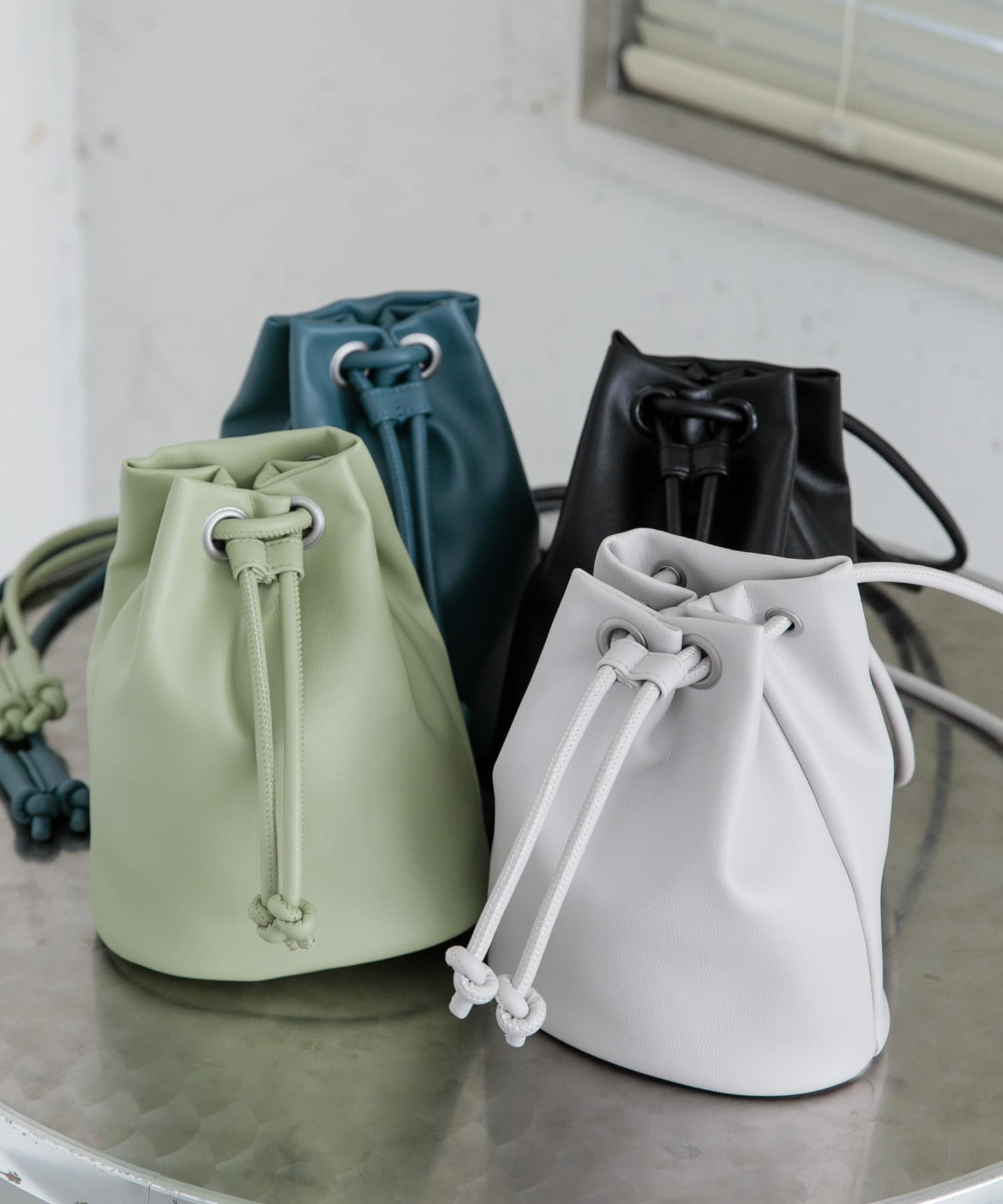 JEANASIS（ジーナシス）の「フェイクレザーキンチャクBAG/996664（ショルダーバッグ）」 - WEAR