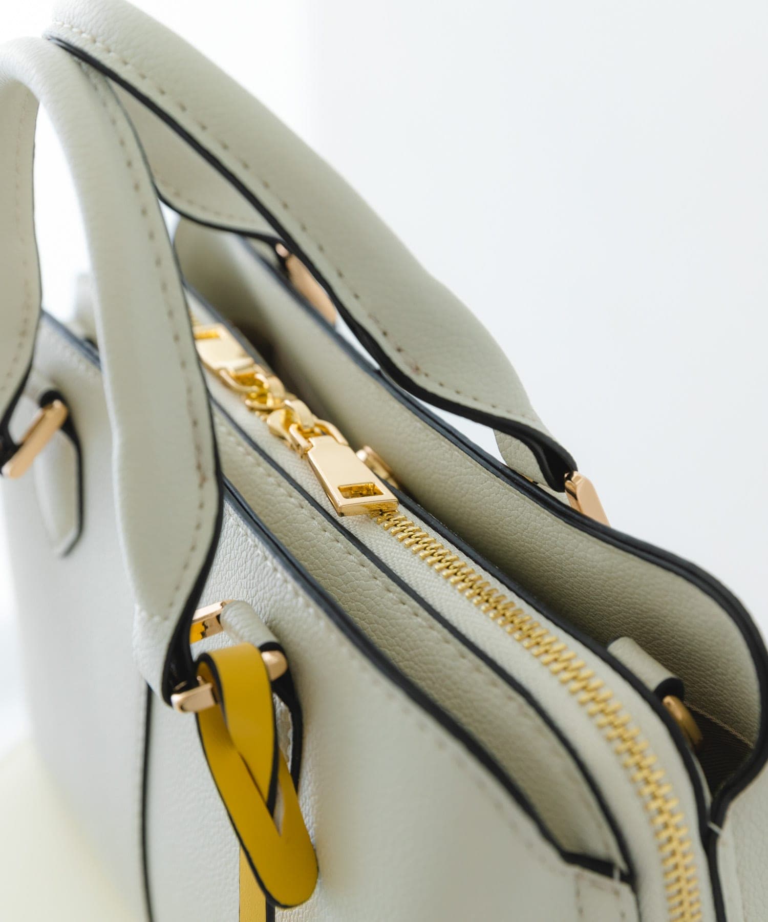 センターステッチハンドバッグ MILK one