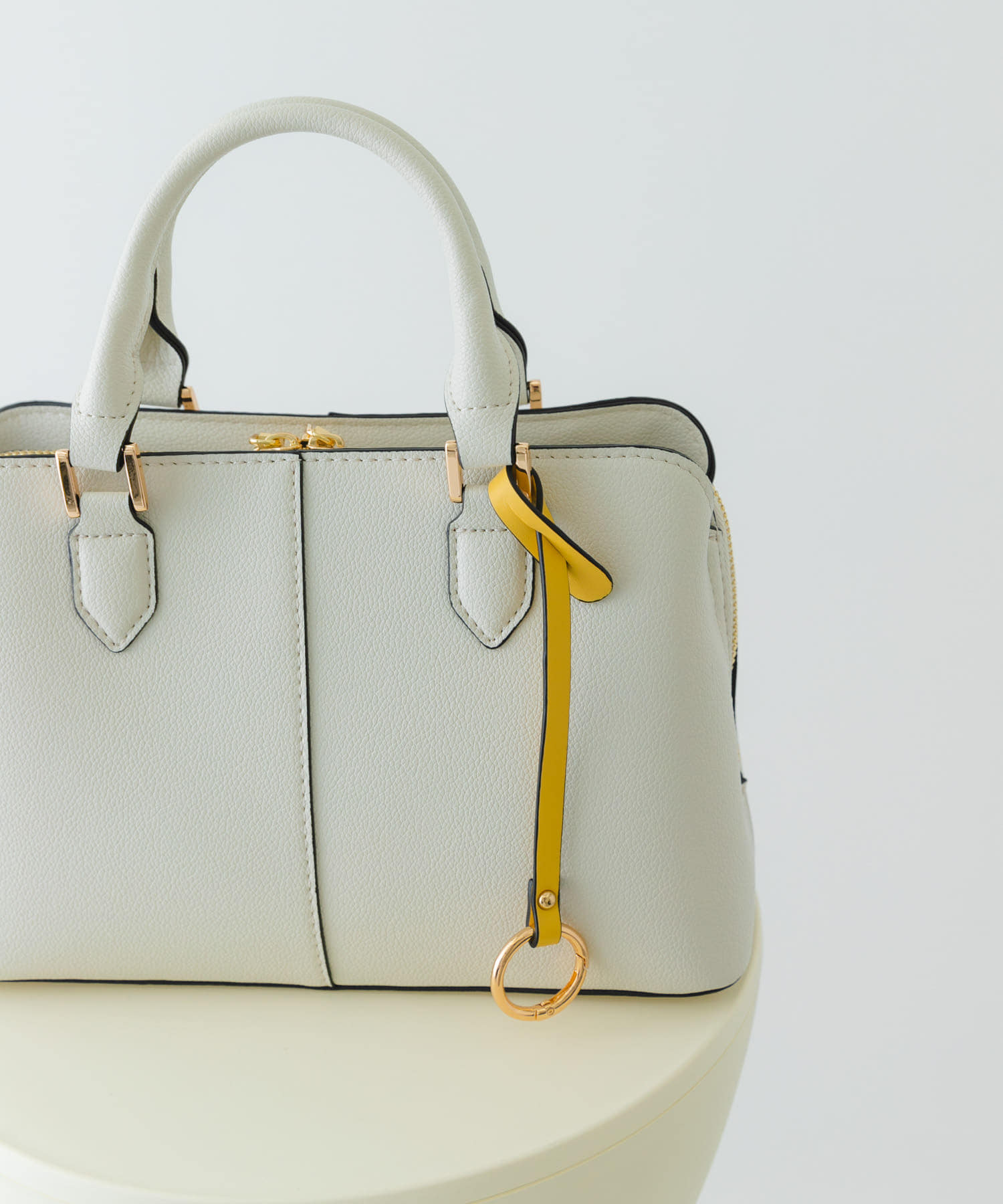 センターステッチハンドバッグ MILK one