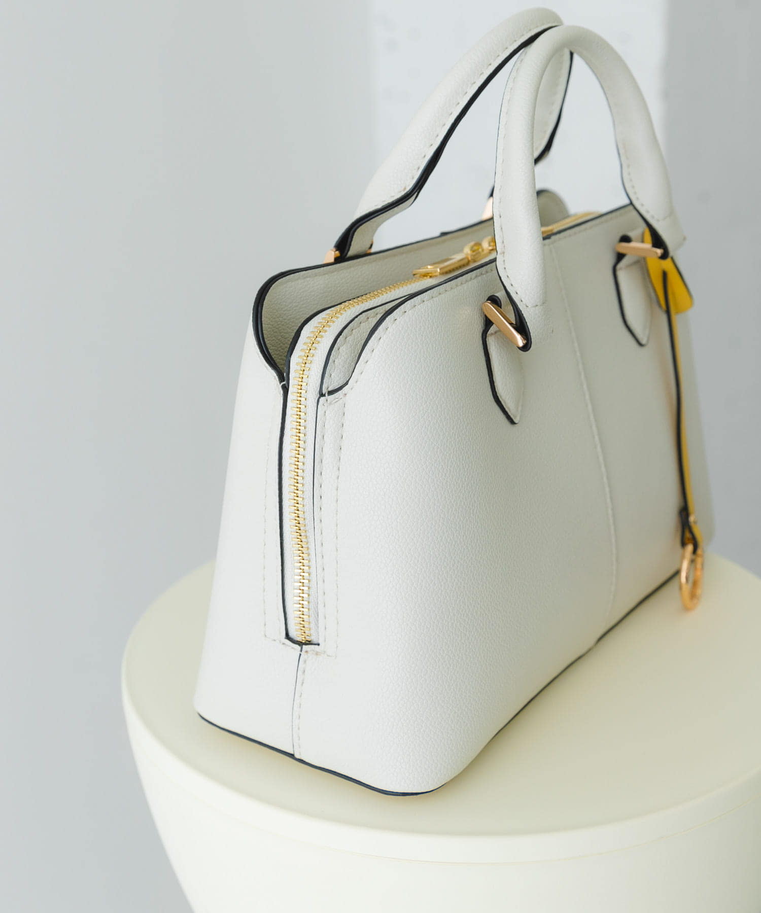 センターステッチハンドバッグ MILK one