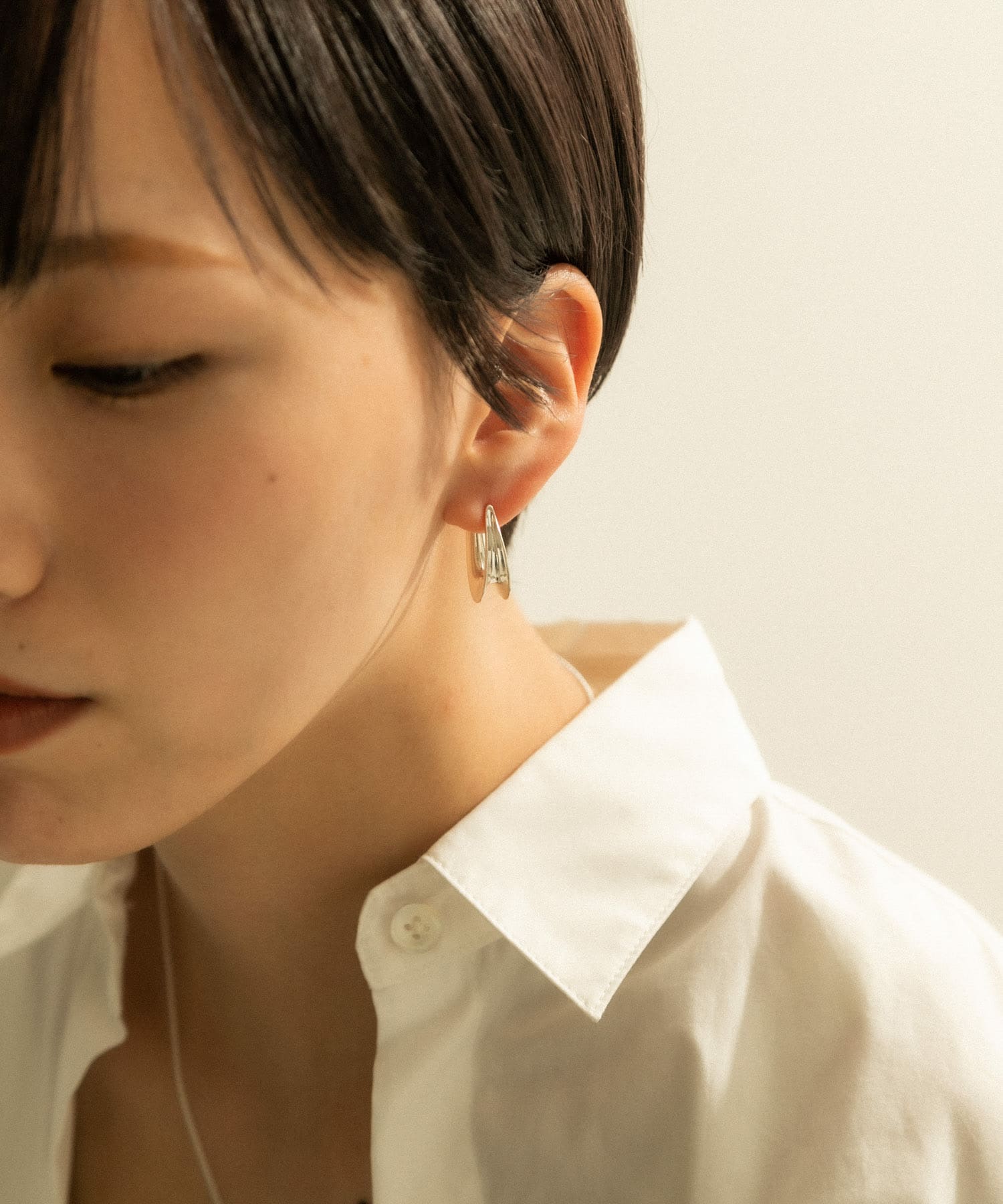 SMELLY so’　curve earring SLV -