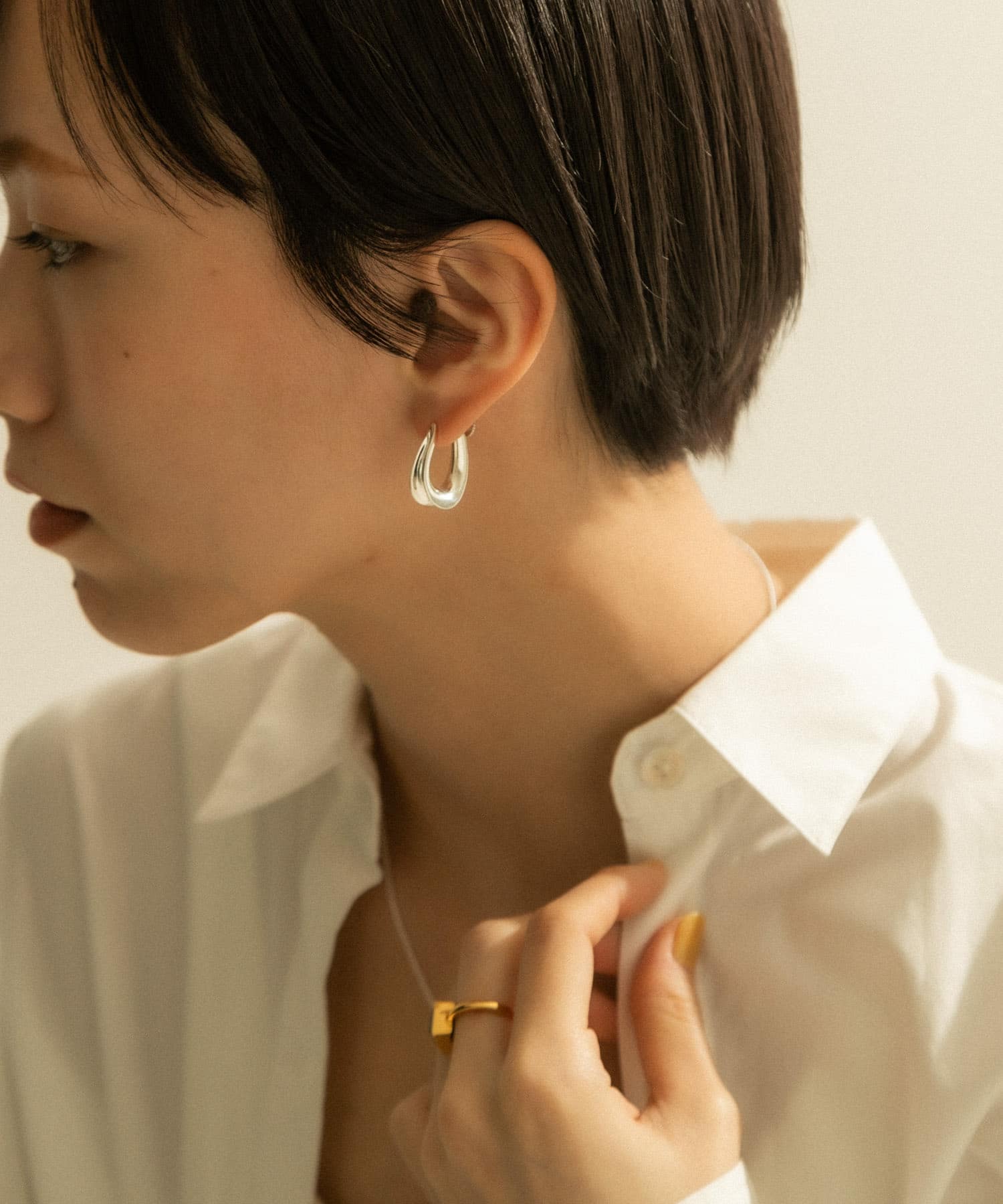 SMELLY so’　curve earring SLV -