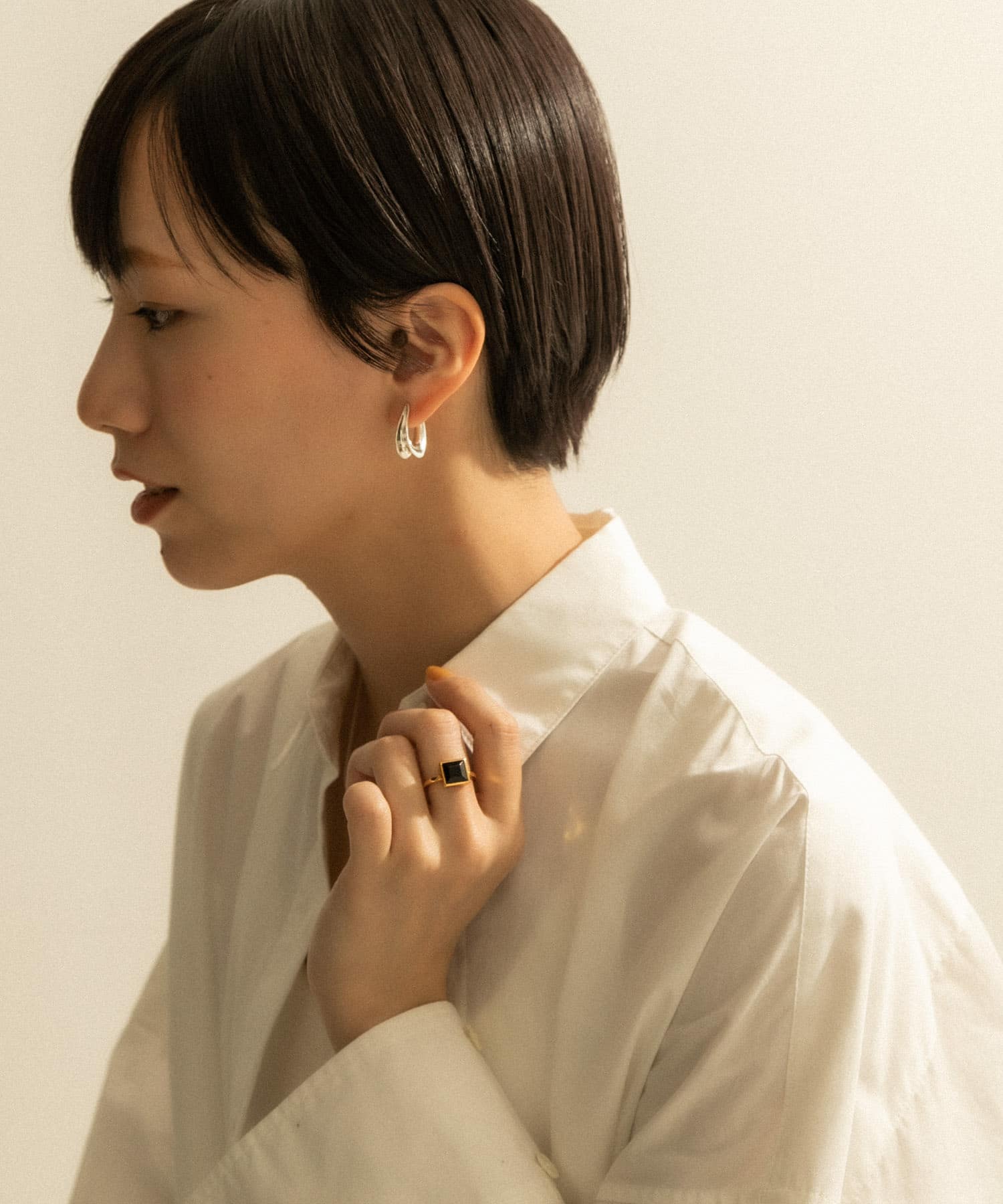 SMELLY so’　curve earring SLV -