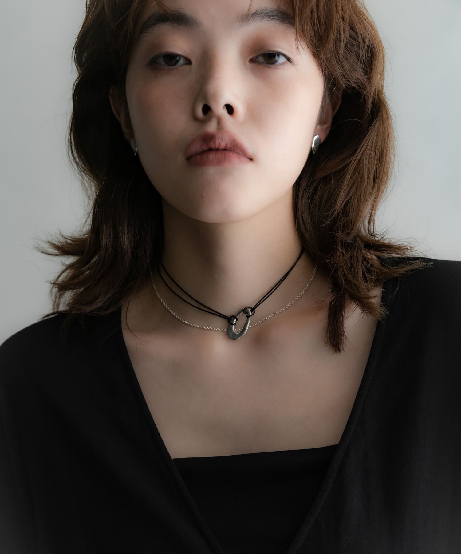SMELLY so’　oval plate cord necklace SLV -