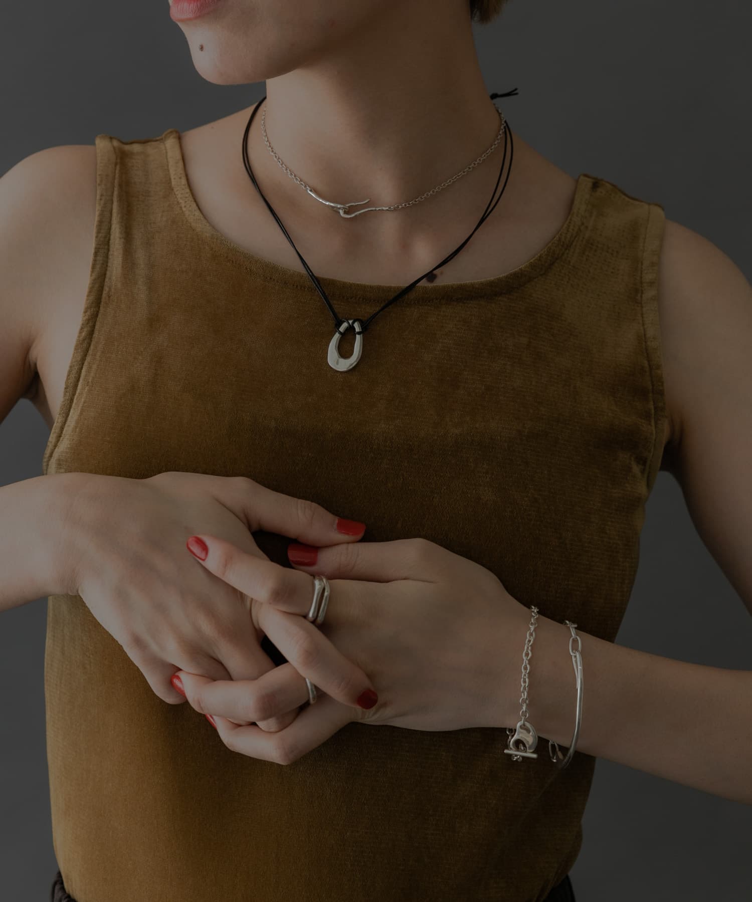 SMELLY so’　oval plate cord necklace SLV -