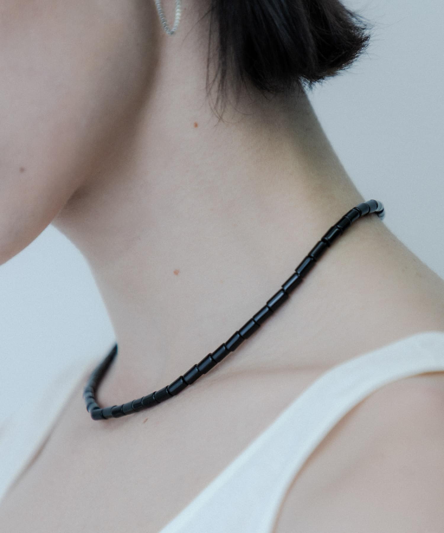 SMELLY so’　onyx mantel necklace