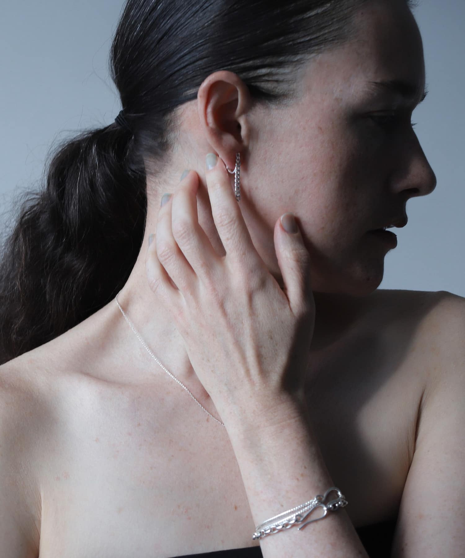 SMELLY so’　asymmetry chain earring SLV -