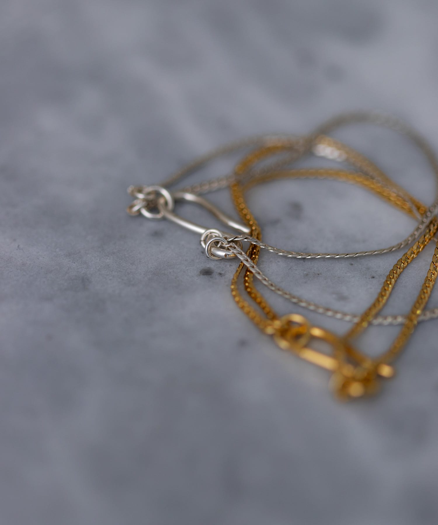SMELLY so’　double chain bracelet GLD -