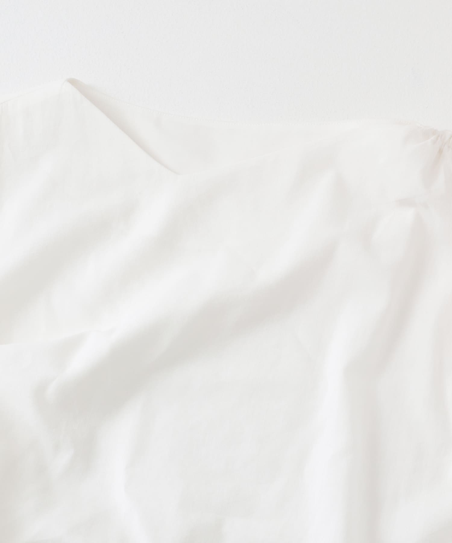 アシンメトリーシャーリングトップ IVORY one