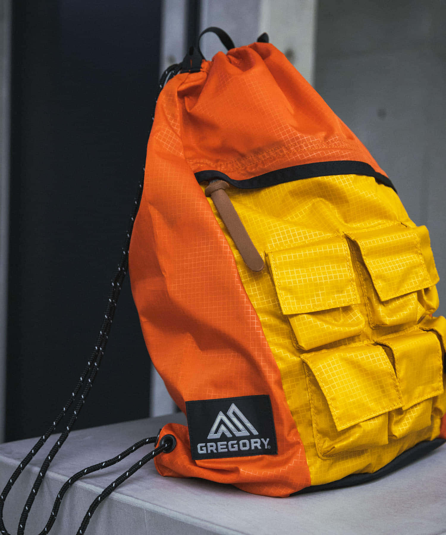 NEXUSVII.×GREGORY　PARASITE KNAPSACK ORN×YEL FREE