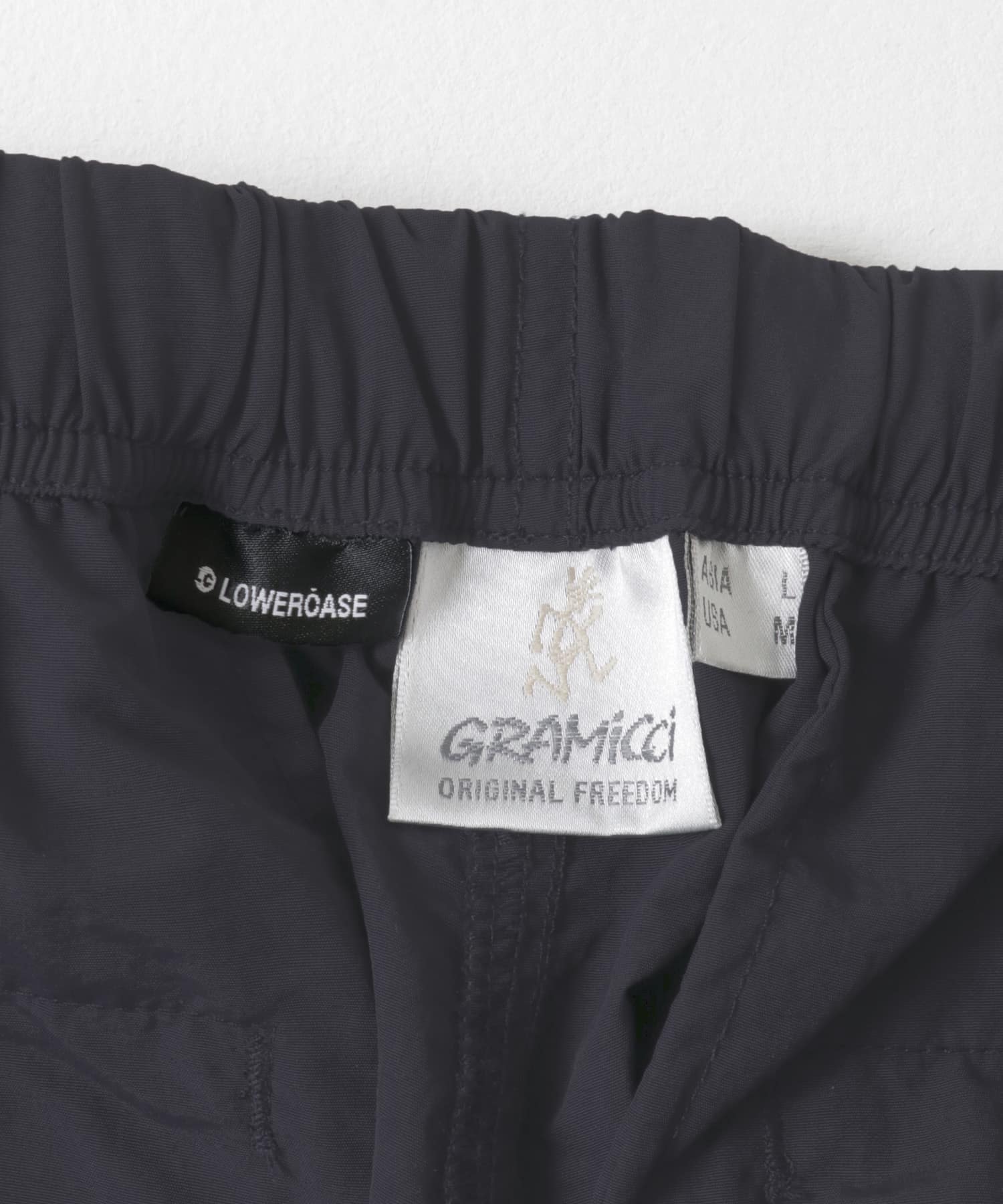 Gramicci / LOWERCASE　NYLON TRACK PANT D.NAVY S