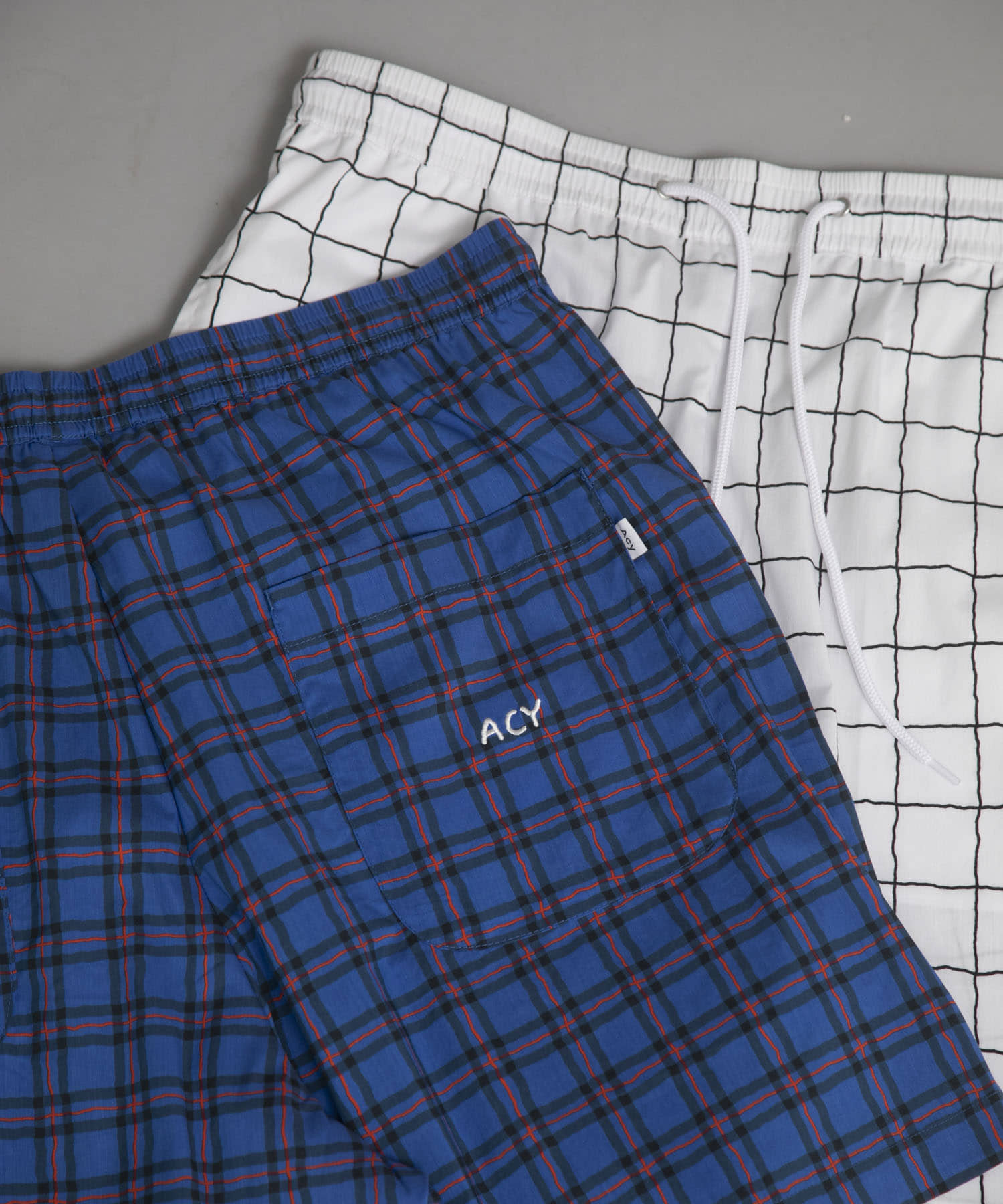 Acy　AK PATTERN SHORTS AK.CHECK 2