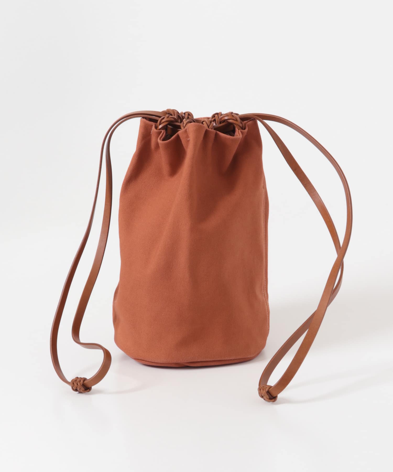 KAMARO’AN　Woven Drawstring BucketBag Ochre-Red one