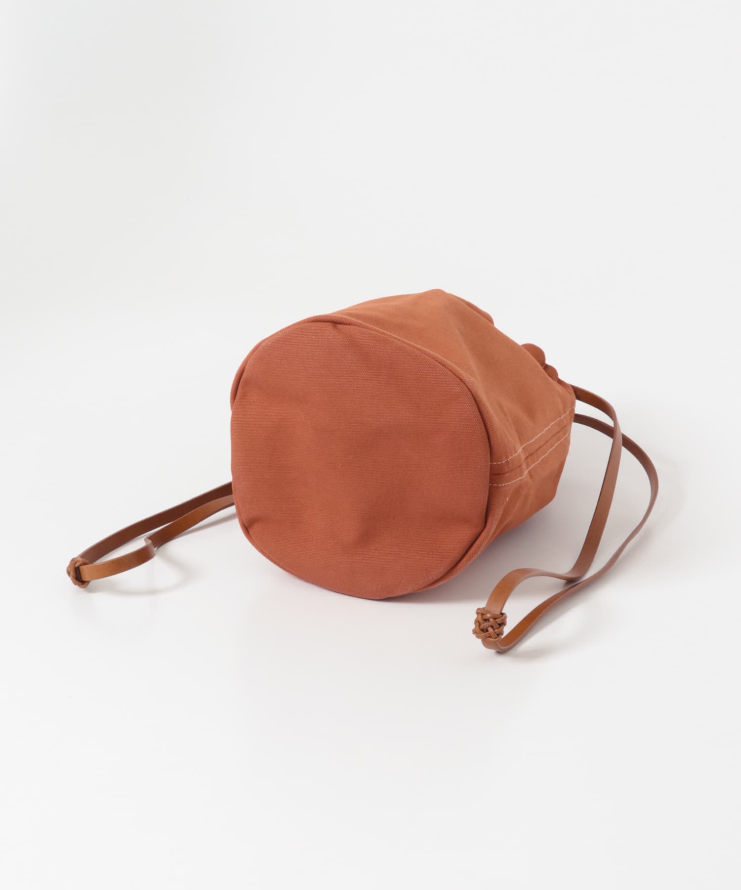 KAMARO’AN　Woven Drawstring BucketBag Ochre-Red one