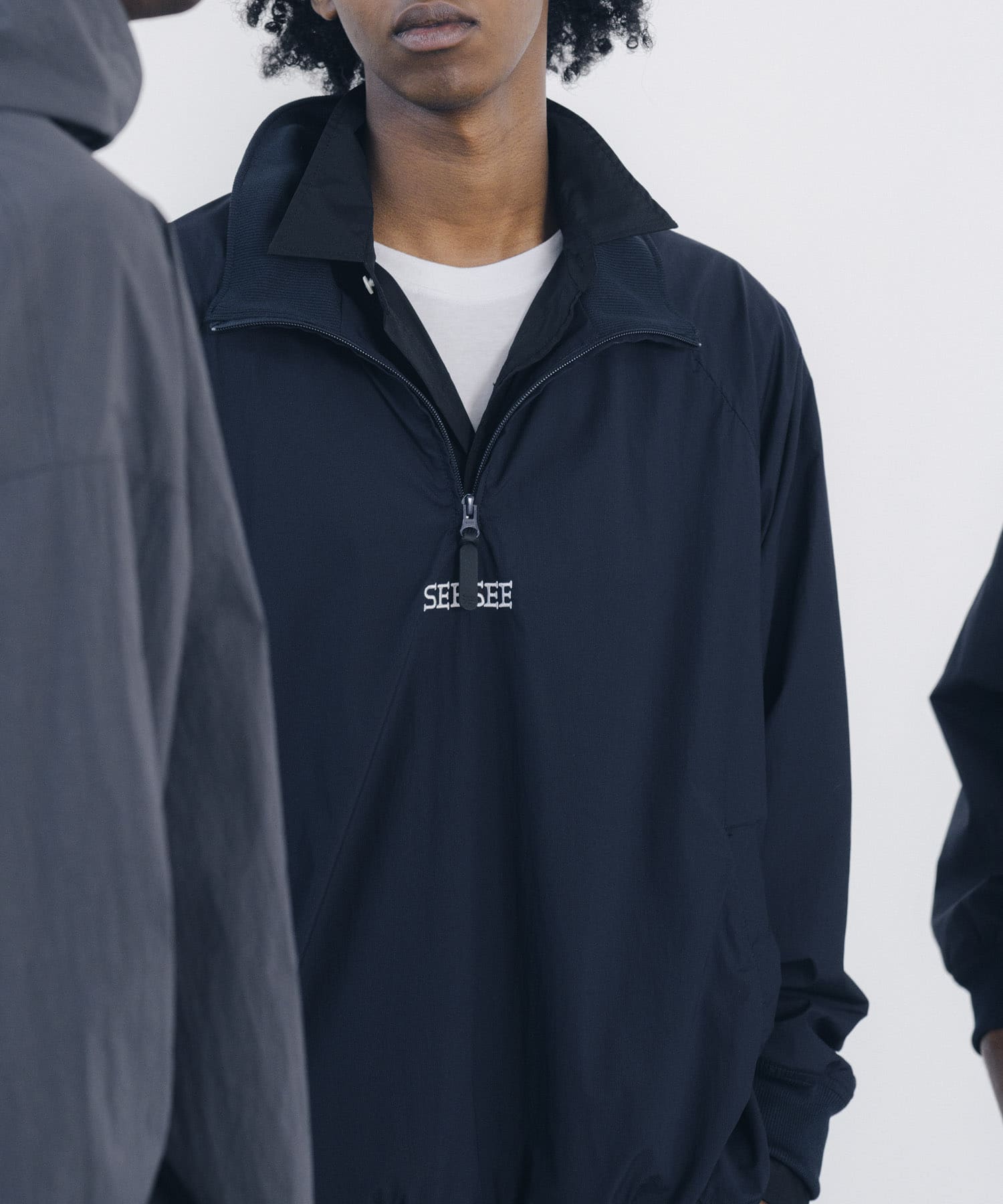 SEE SEE　HALF ZIP NYLON JACKET