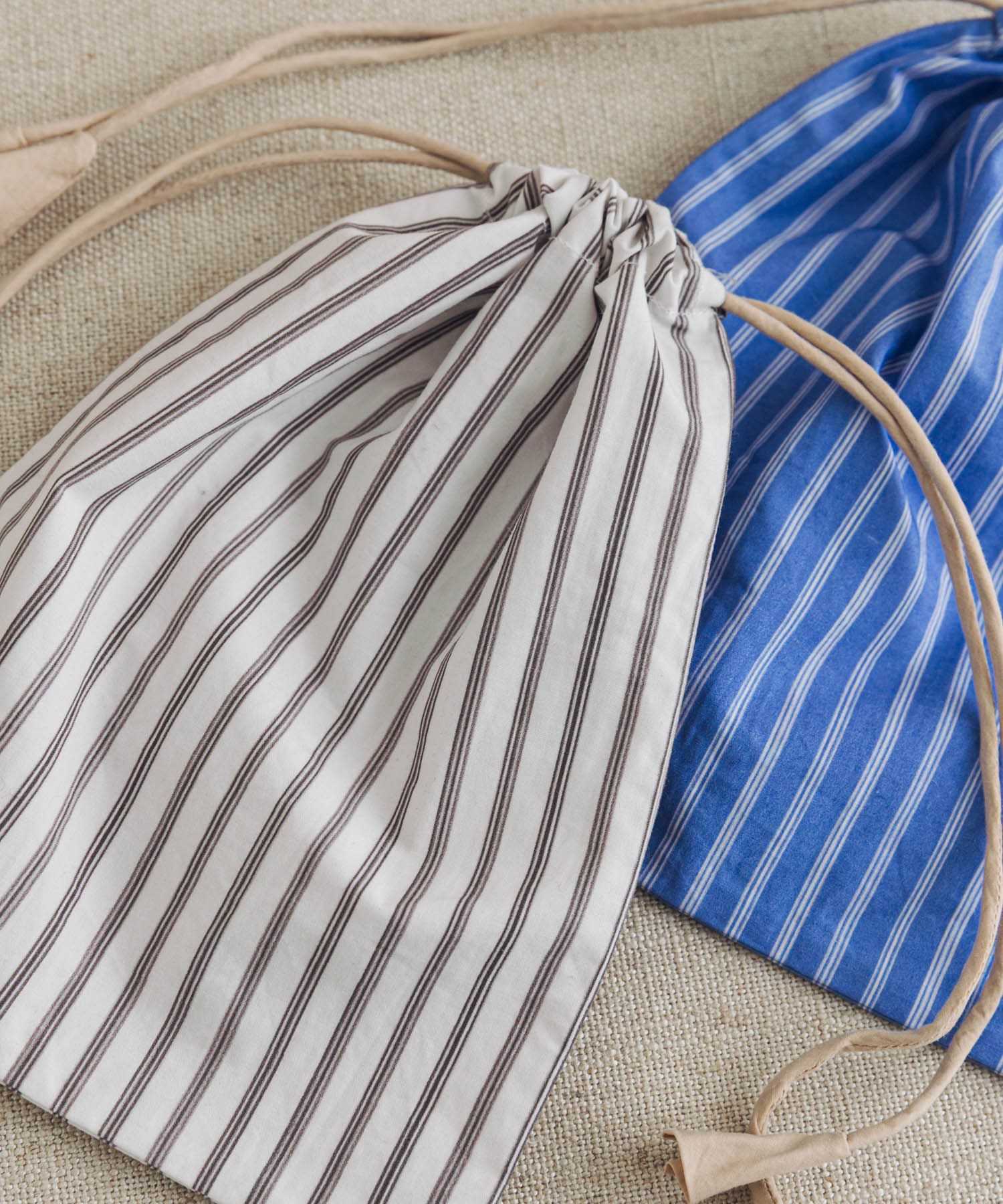 『別注』miiThaaii×DOORS LIVING PRODUCTS　ストライプ巾着M WH×BR M