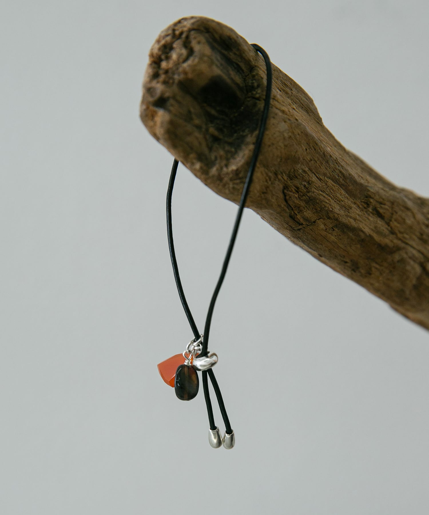 SMELLY so’　duo stone cord bracelet